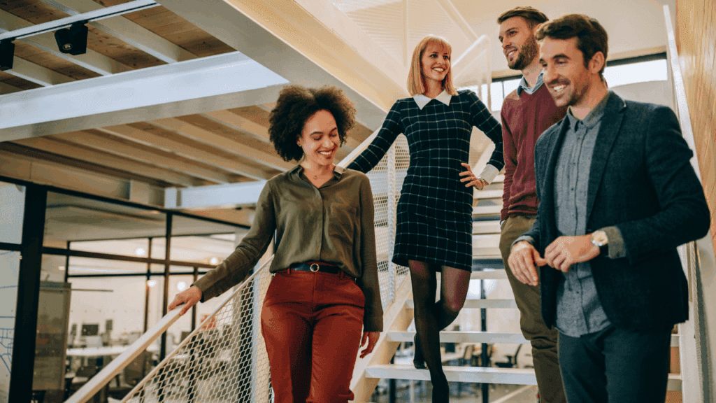 Business professionals on stairs, conveying  no more sense of isolation and disconnection in their work environment.